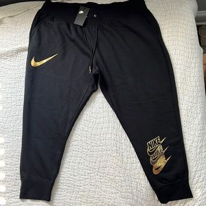 Nike woman’s black and golden sweatpants